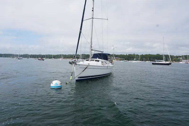 Slide: The Image of Sailboat Hunter 41 Deck Salon 2006 anchored in a scenic harbor. - 12