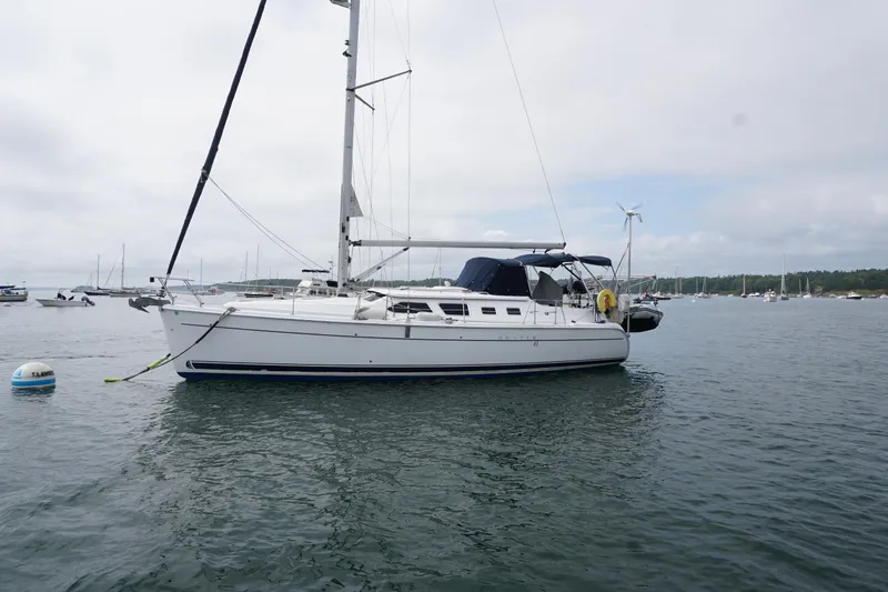 Slide: The Image of 2006 Hunter 41 Deck Salon sailboat anchored in a calm harbor. - 14