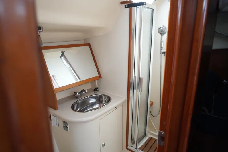 Slide: The Image of Bathroom interior of 2006 Hunter 41 Deck Salon with sink and shower. - 9