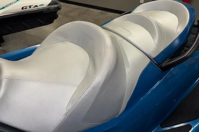 Slide: The Image of 2018 Sea-Doo GTX 155 jet ski with white and blue seating. - 12