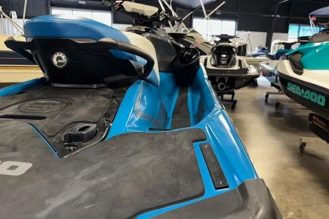 Slide: The Image of 2018 Sea-Doo GTX 155 jet ski in a showroom, featuring a sleek blue design. - 5