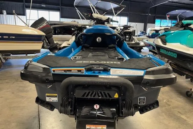 Slide: The Image of 2018 Sea-Doo GTX 155 jet ski in a showroom, rear view. - 7