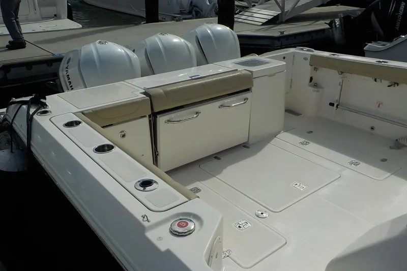 Slide: The Image of 2020 Pursuit OS 355 Offshore boat deck with seating and storage compartments. - 15