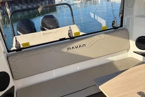Slide: The Image of Interior of 2025 Navan C30 boat with seating and twin engines visible. - 14