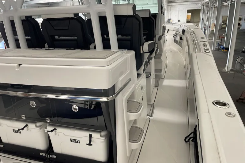 Slide: The Image of 2025 Blackfin 400 CC boat interior with seating and storage compartments. - 10