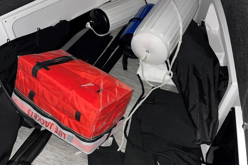 Slide: The Image of Interior of 2025 Blackfin 400 CC boat with life jackets and fenders. - 21