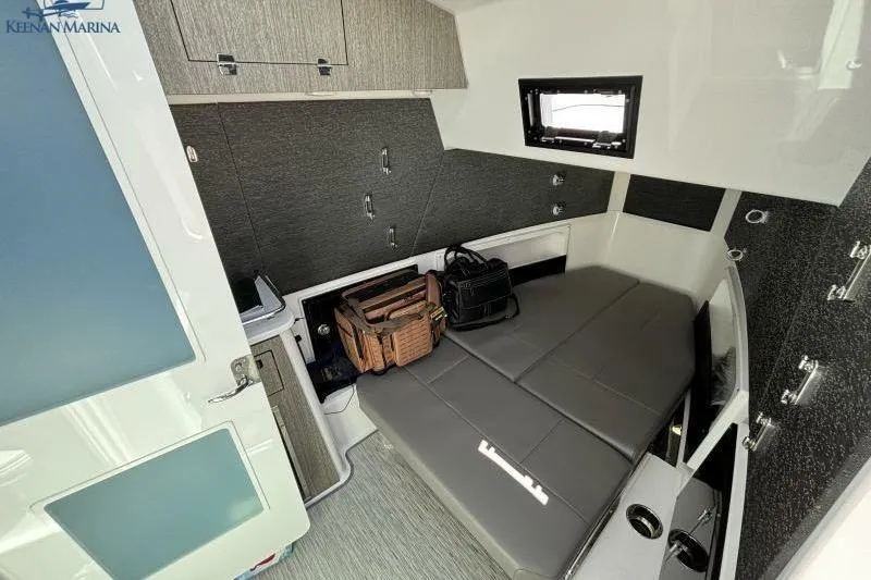 Slide: The Image of 2025 Blackfin 400 CC cabin interior with modern design and storage space. - 28