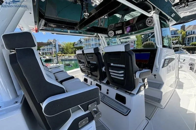 Slide: The Image of Interior of 2025 Blackfin 400 CC boat with modern seating and control panel. - 4