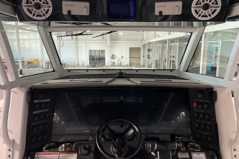 Slide: The Image of 2025 Blackfin 400 CC boat cockpit with advanced Garmin navigation system. - 6