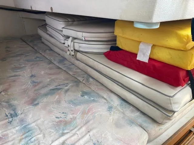 Slide: The Image of Interior cushions and life jackets on a 1995 Catalina 30 Mk III sailboat. - 12