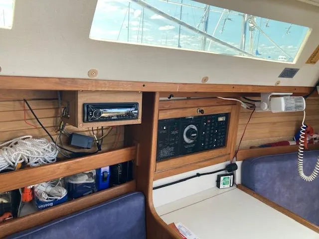 Slide: The Image of Interior of a 1995 Catalina 30 Mk III sailboat with control panel and storage. - 15
