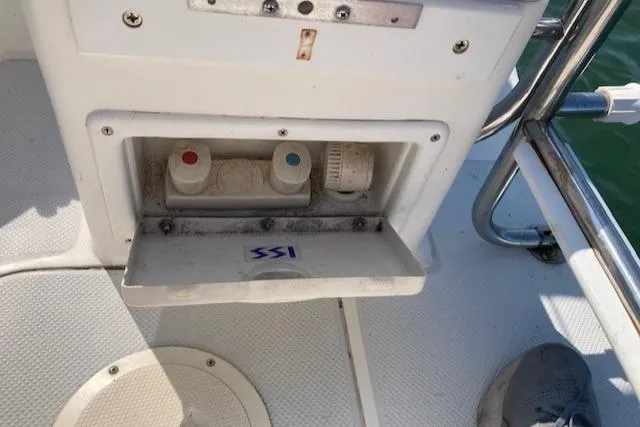 Slide: The Image of Sailboat deck with open compartment showing water connections, Catalina 30 Mk III, 1995 model. - 19