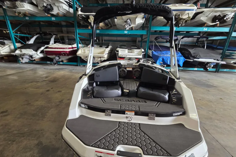 Slide: The Image of 2023 Scarab 165 H.O. Platinum boat interior with sleek seating and modern design. - 10