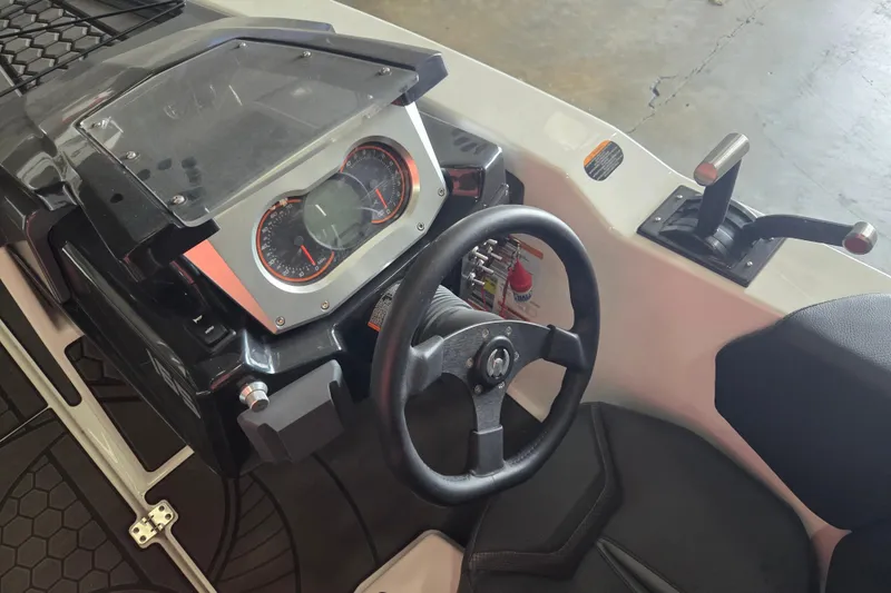 Slide: The Image of 2023 Scarab 165 H.O. Platinum boat interior with sleek seating and modern design. - 4