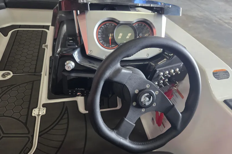 Slide: The Image of 2023 Scarab 165 H.O. Platinum boat dashboard with JL Audio MediaMaster 50 system. - 8