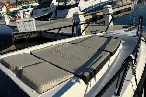 Slide: The Image of 2025 Navan C30 boat with cushioned deck at marina. - 23