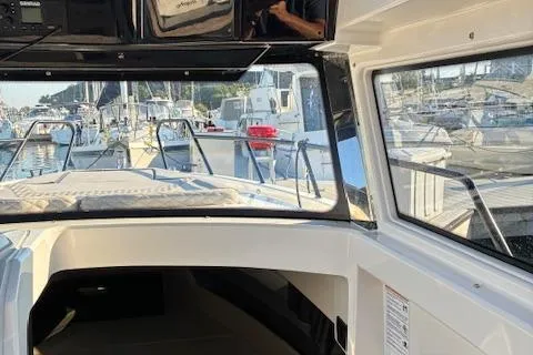 Slide: The Image of Interior view of 2025 Navan C30 boat docked at a marina. - 34