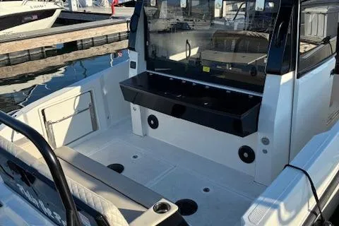 Slide: The Image of 2025 Navan C30 boat interior at marina, featuring spacious deck and modern design. - 6