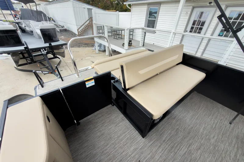 Slide: The Image of Interior view of 2026 Godfrey Sweetwater Xperience 22' Tritoon with beige flip lounge seating. - 11