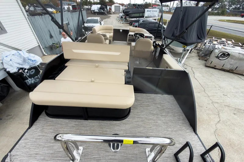 Slide: The Image of 2026 Godfrey Sweetwater Xperience 22' Tritoon with single flip lounge, beige seating, and spacious deck. - 15