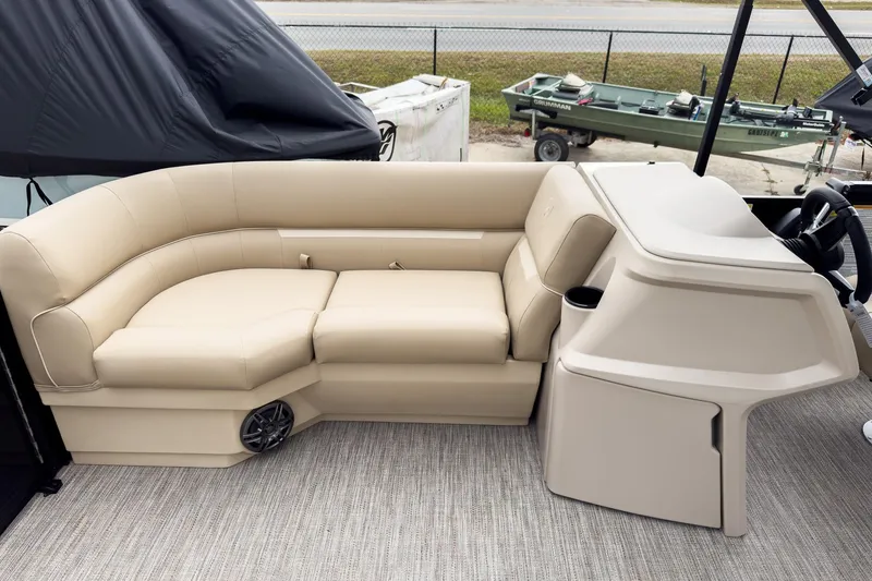 Slide: The Image of 2026 Godfrey Sweetwater Xperience 22' Tritoon with beige flip lounge seating. - 22