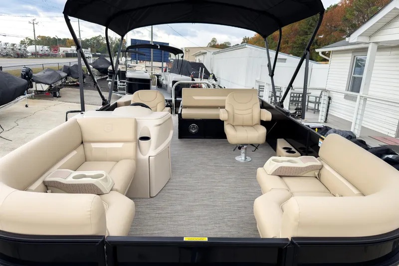 Slide: The Image of 2026 Godfrey Sweetwater Xperience 22' Tritoon with luxurious seating and canopy. - 5