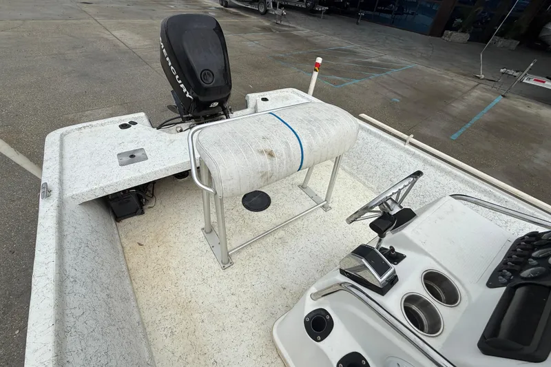 Slide: The Image of 2008 Mako 191 Inshore boat interior with Mercury outboard motor, console, and seating. - 12