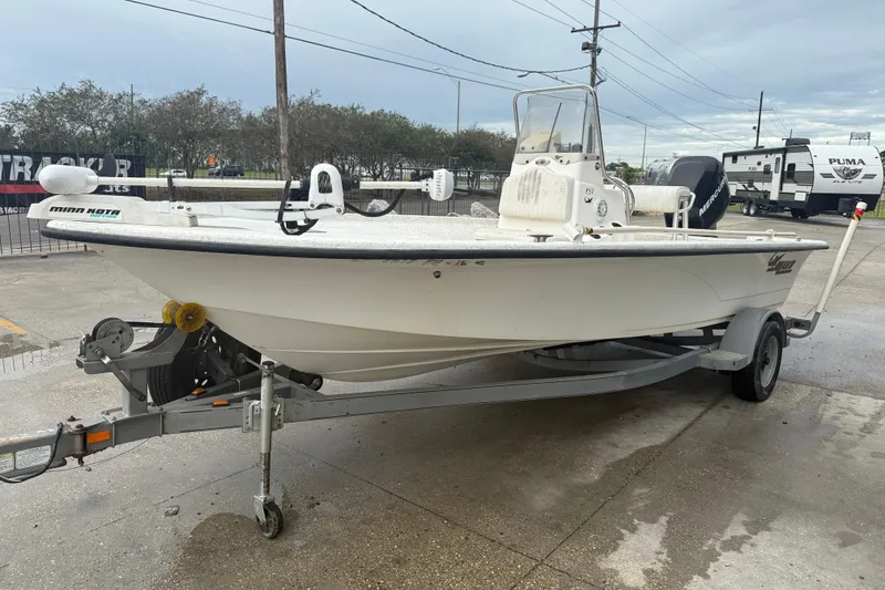 Slide: The Image of 2008 Mako 191 Inshore boat on trailer, parked outdoors, with overcast sky. - 4