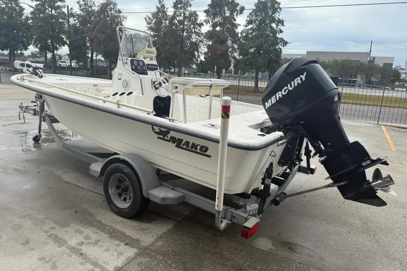 Slide: The Image of 2008 Mako 191 Inshore boat on trailer with Mercury outboard motor. - 5