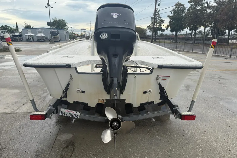 Slide: The Image of 2008 Mako 191 Inshore boat on trailer, rear view with outboard motor. - 6