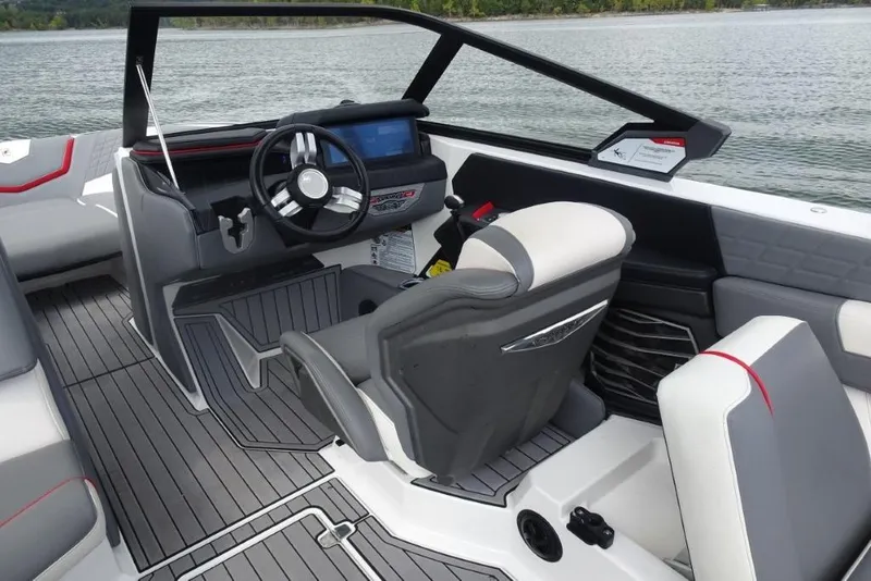 Slide: The Image of 2021 Nautique Super Air Nautique G23 boat interior with modern dashboard and seating. - 10