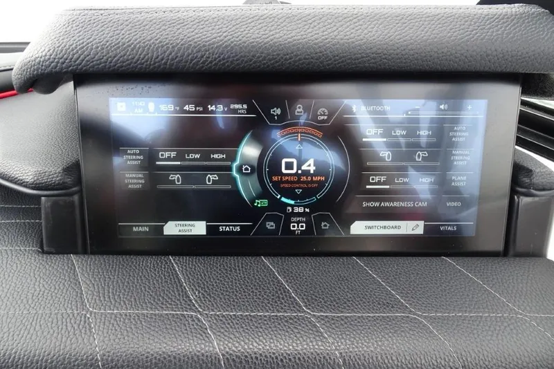 Slide: The Image of 2021 Nautique Super Air Nautique G23 dashboard display showing speed and control settings. - 13