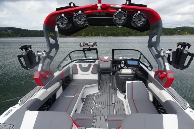 Slide: The Image of 2021 Nautique Super Air Nautique G23 boat interior with modern seating and advanced audio system. - 8