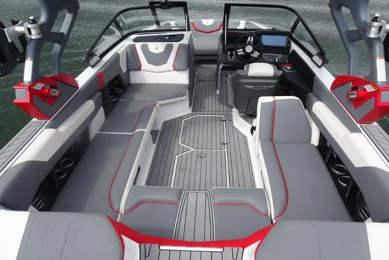 Slide: The Image of 2021 Nautique Super Air Nautique G23 interior with sleek seating and modern dashboard. - 9
