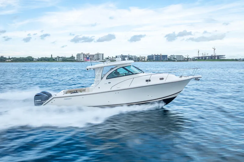 Slide: The Image of 2011 Pursuit OS 345 Offshore boat cruising on open water. - 16