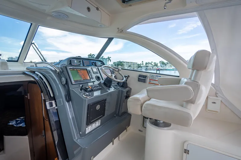 Slide: The Image of Helm of 2011 Pursuit OS 345 Offshore boat with modern navigation equipment. - 57