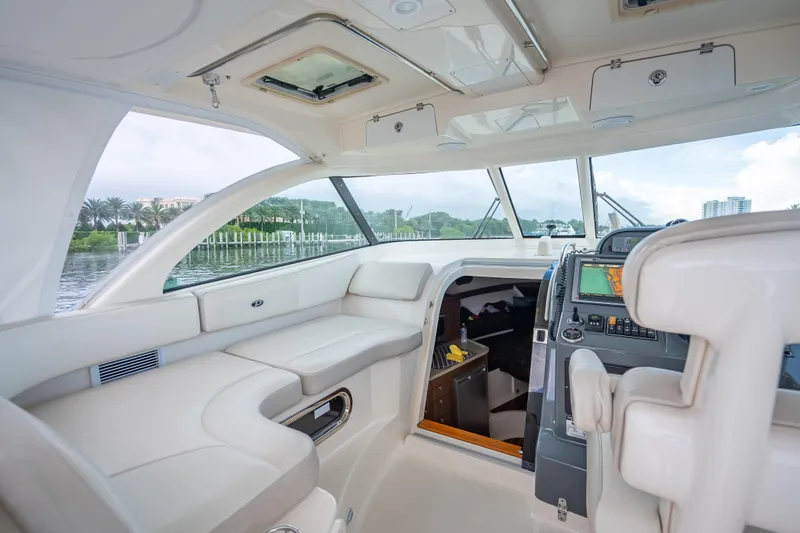 Slide: The Image of Luxurious interior of 2011 Pursuit OS 345 Offshore boat with navigation equipment. - 61