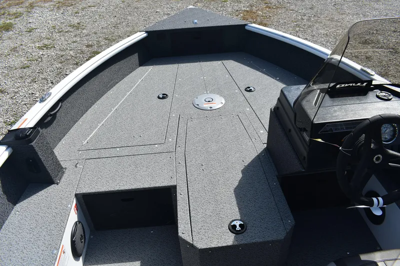 Slide: The Image of 2026 Lund 1800 Explorer SS boat with open storage compartment on deck. - 15