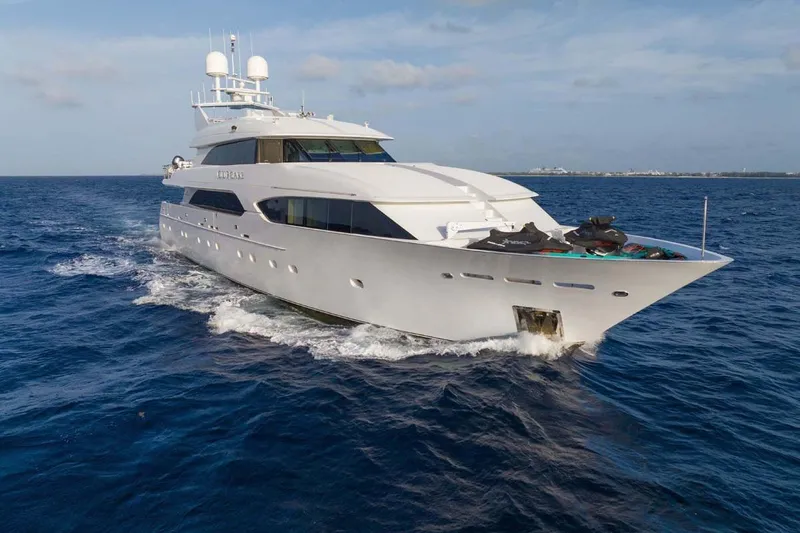 The Image of Luxurious 2001 Westship Skylounge yacht cruising on open sea under clear skies. - 1