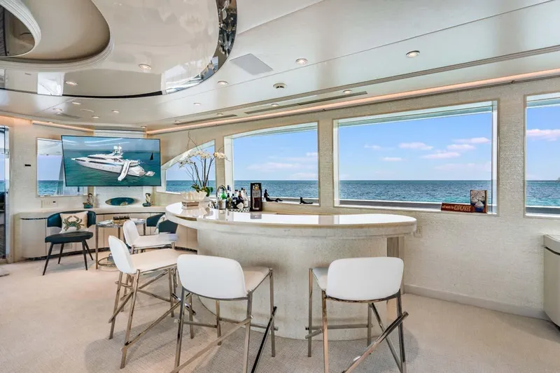 Slide: The Image of Luxurious 2001 Westship Skylounge interior with ocean view, featuring elegant bar and seating area. - 10