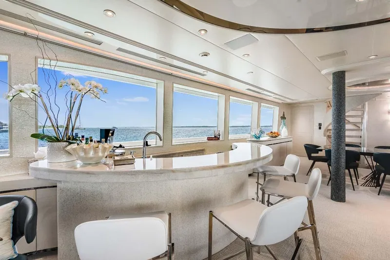 Slide: The Image of Luxurious 2001 Westship Skylounge interior with elegant bar and ocean views. - 11