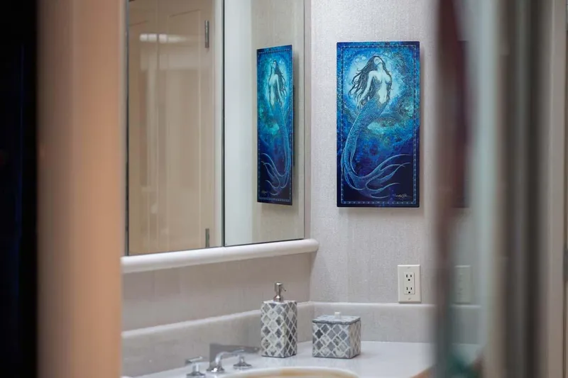 Slide: The Image of Bathroom interior of 2001 Westship Skylounge yacht with mermaid artwork and elegant decor. - 18