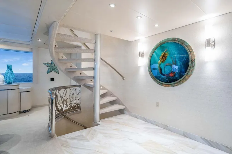 Slide: The Image of Luxurious 2001 Westship Skylounge interior with spiral staircase and ocean-themed decor. - 20