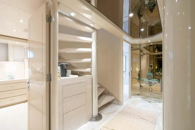 Slide: The Image of Luxurious interior of 2001 Westship Skylounge yacht with elegant staircase and modern decor. - 28