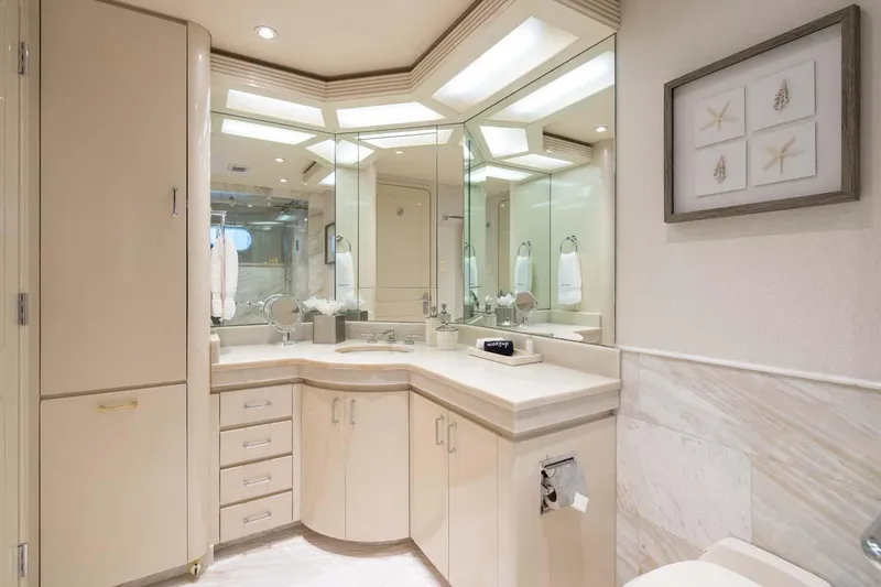 Slide: The Image of Luxurious bathroom in 2001 Westship Skylounge yacht with elegant cabinetry and mirrored walls. - 32