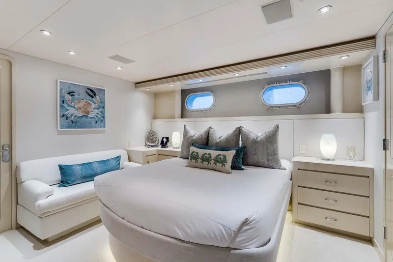 Slide: The Image of Luxurious 2001 Westship Skylounge yacht bedroom with elegant decor and ocean-themed artwork. - 33