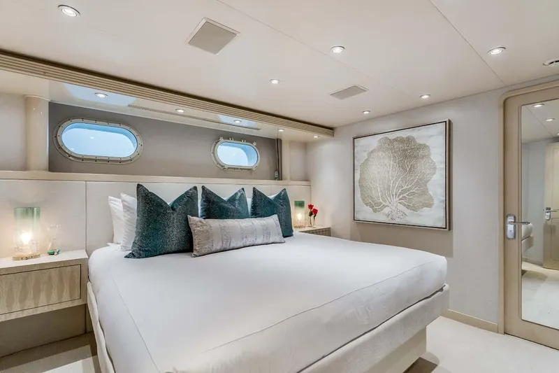 Slide: The Image of Luxurious 2001 Westship Skylounge bedroom with elegant decor and ocean-view portholes. - 37