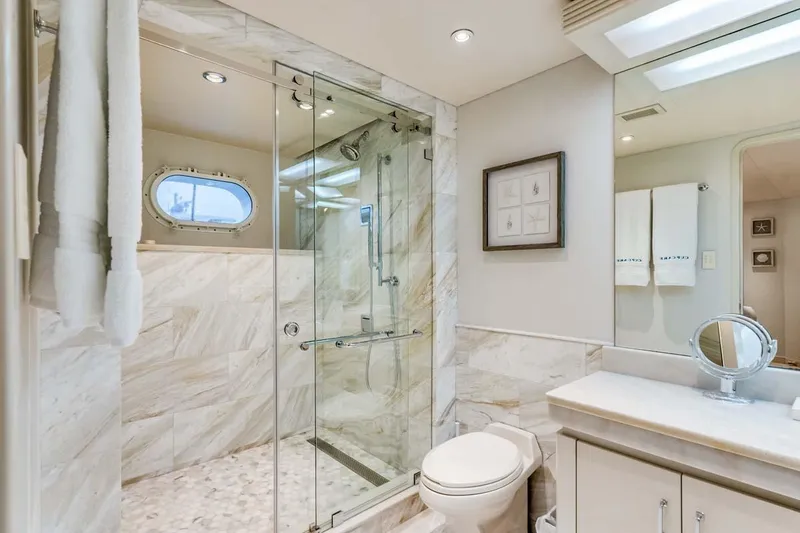 Slide: The Image of Luxurious bathroom in 2001 Westship Skylounge yacht with marble shower and elegant fixtures. - 39