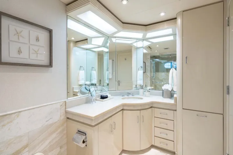 Slide: The Image of Luxurious bathroom in 2001 Westship Skylounge yacht with elegant fixtures and mirrored cabinetry. - 40