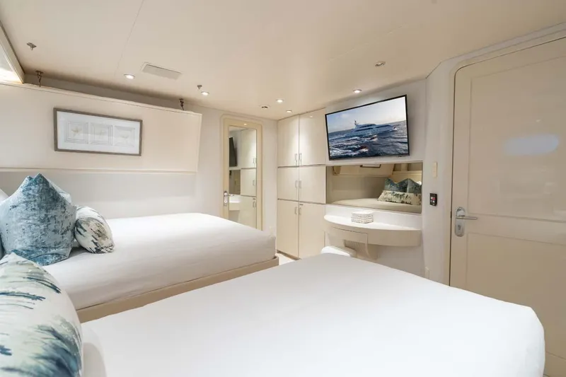 Slide: The Image of Luxurious 2001 Westship Skylounge yacht bedroom with modern decor and wall-mounted TV. - 42